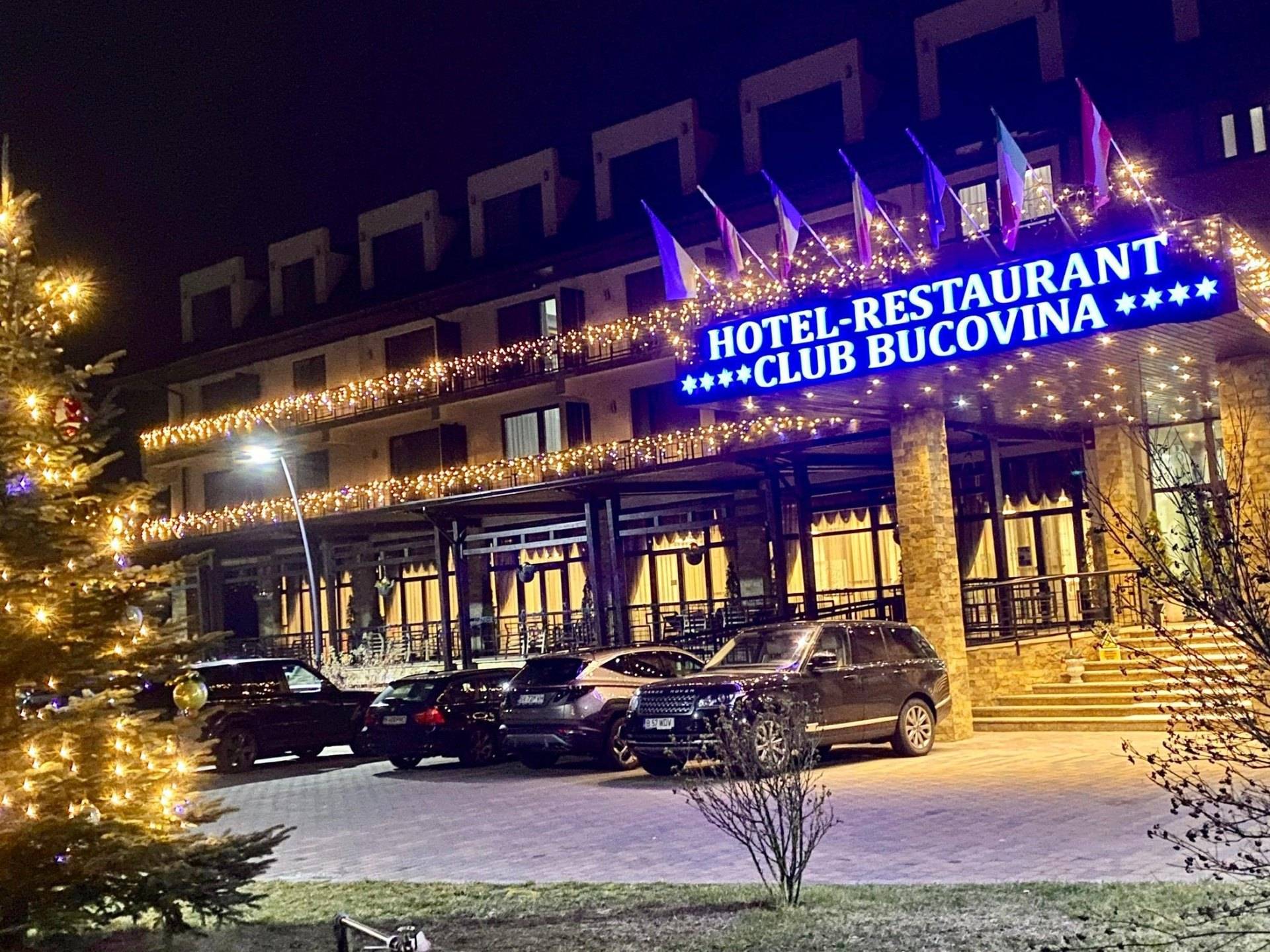 Club Bucovina facade with festive evening lighting